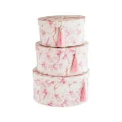 Boîtes rondes en papier à décor floral rose et crème et couvercle à pompon - les 3 boîtes