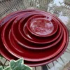 Soucoupe ronde en terre émaillée coloris cerise Les Poteries d'Albi - Ø 33 x H 4 cm